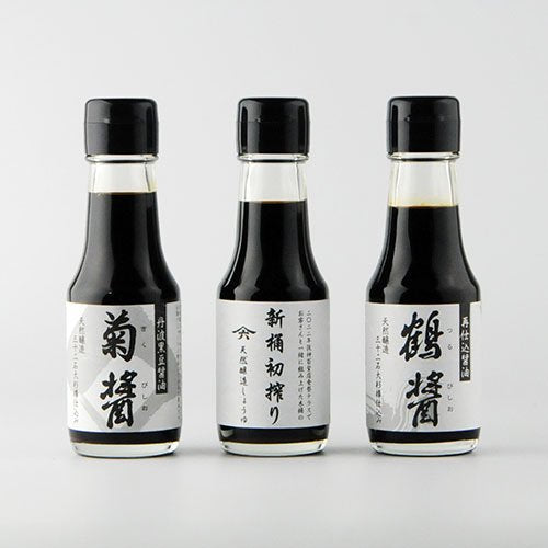 Three bottles of Yamaroku soy sauce